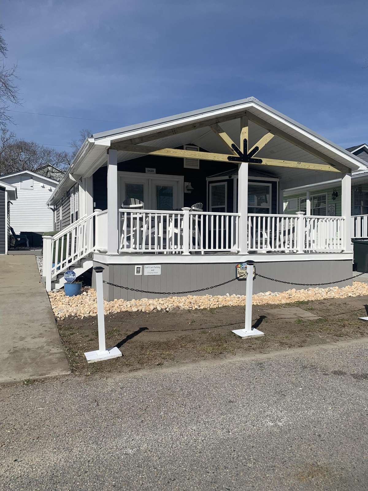Cozy front porch retreat perfect for morning coffee and sunsets - property