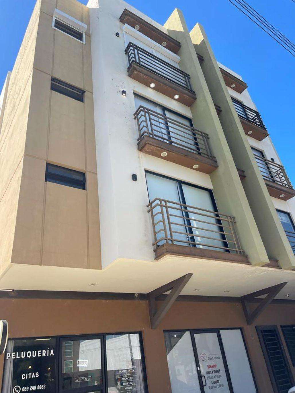 Modern multi-story building with spacious balconies and large windows - property