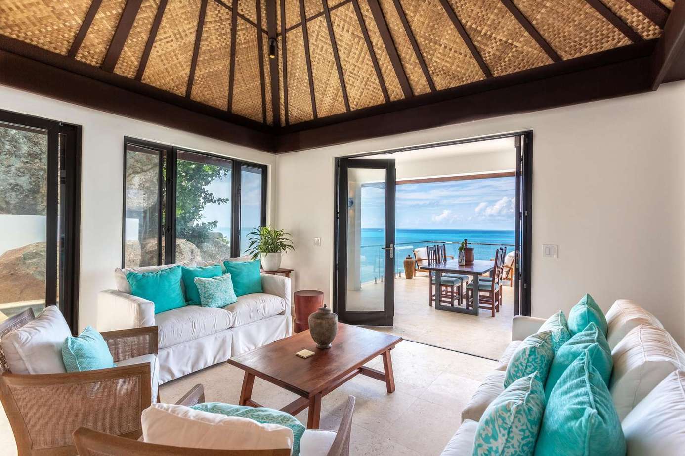 Airy living room with ocean views and tropical breeze