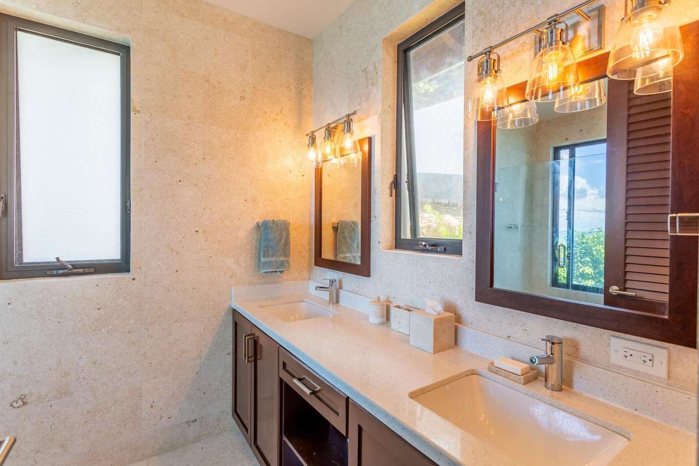Spacious bathroom with dual sinks and elegant lighting