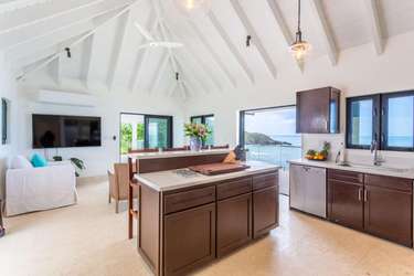 Bright open kitchen and living area with stunning ocean views