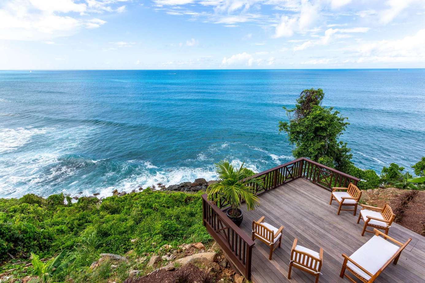 Oceanfront deck with panoramic sea views and cozy seating