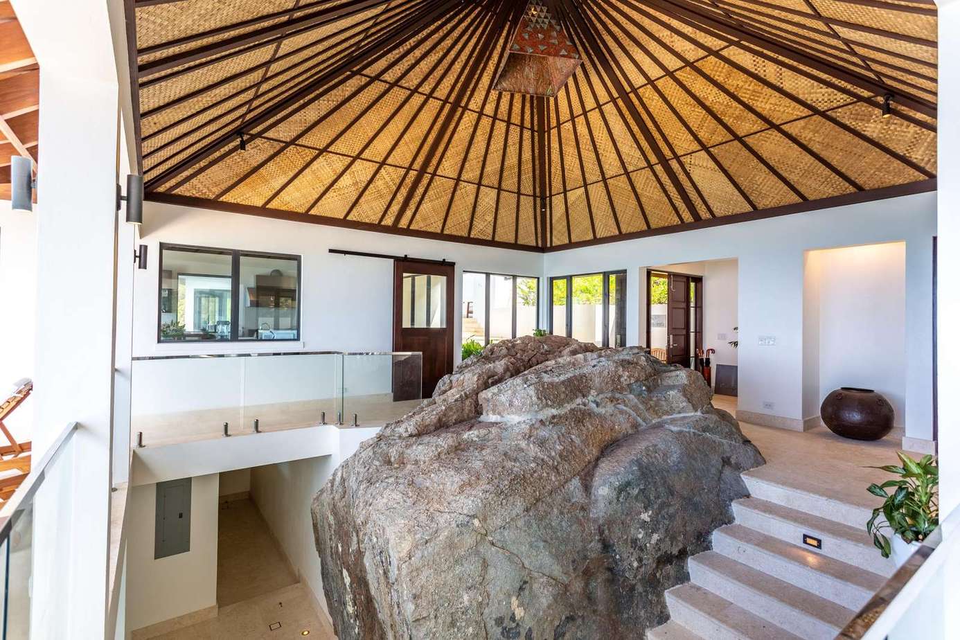 Unique indoor rock feature with open, airy living space