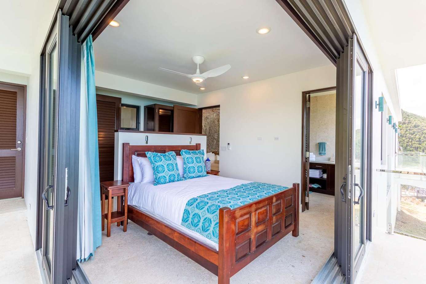 Airy bedroom with seamless indoor-outdoor flow and cozy decor