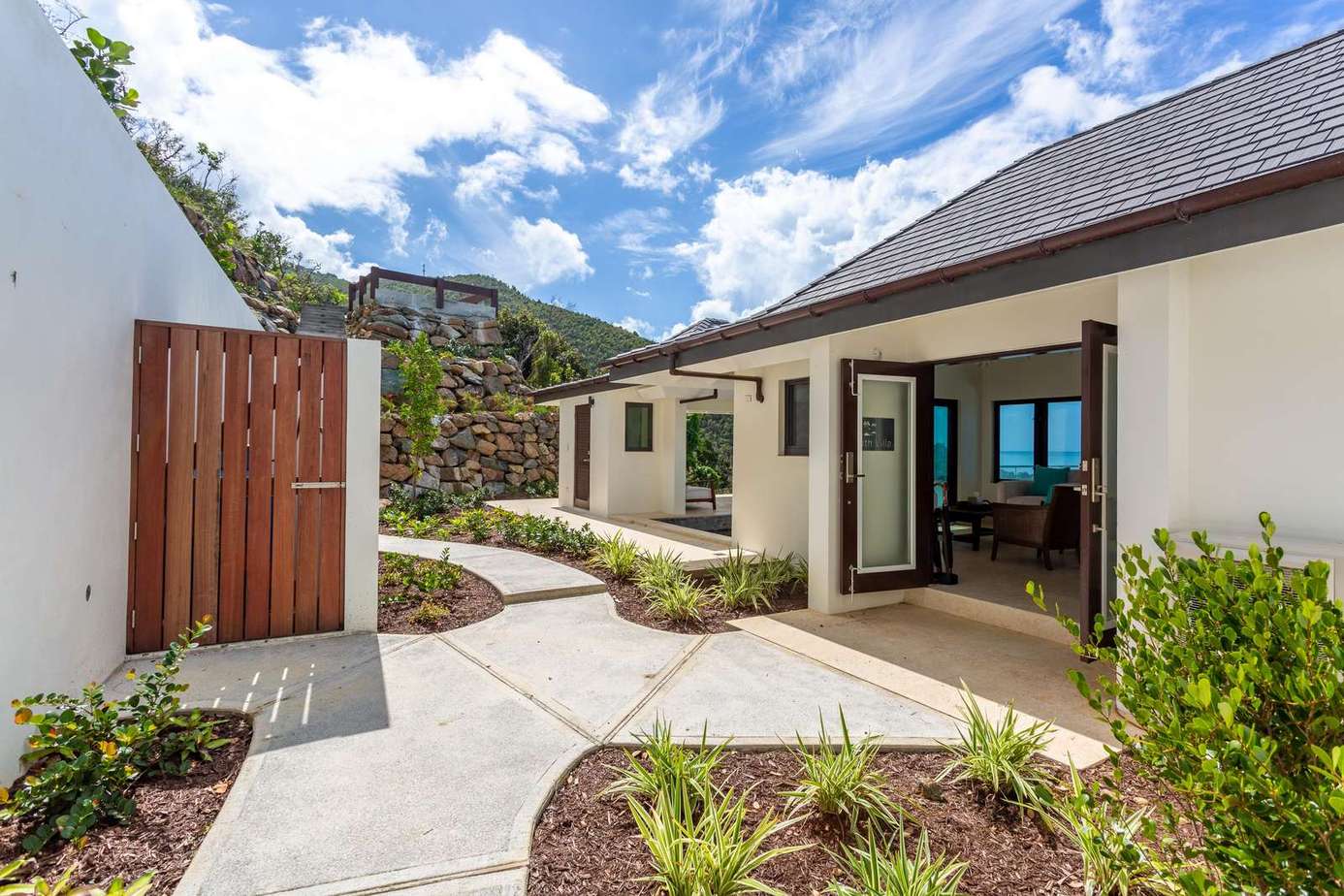 Sunlit courtyard with mountain views and open-air comfort