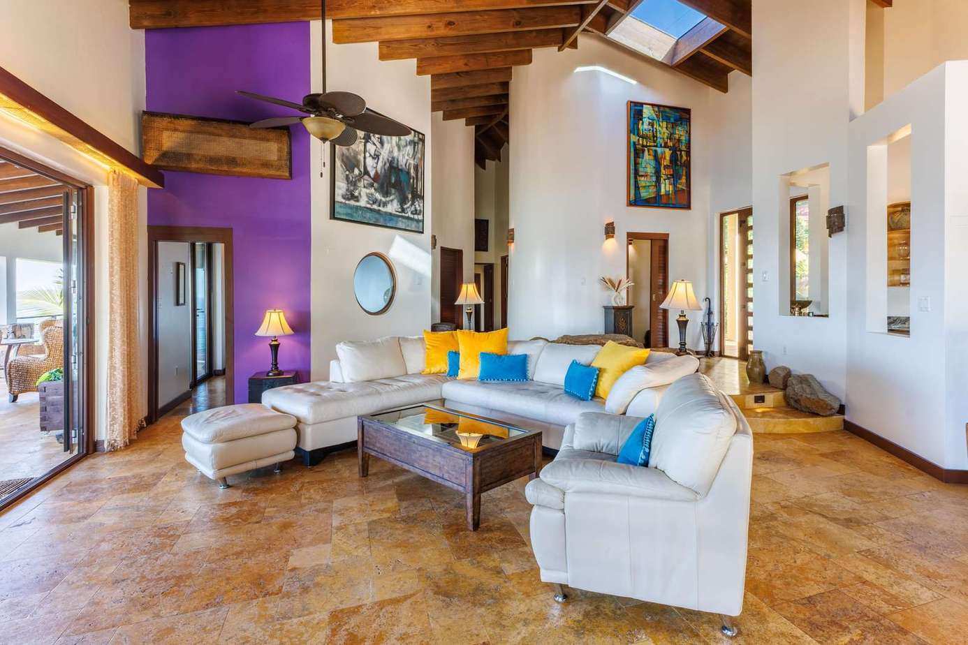 Spacious living room with vibrant accents and natural light