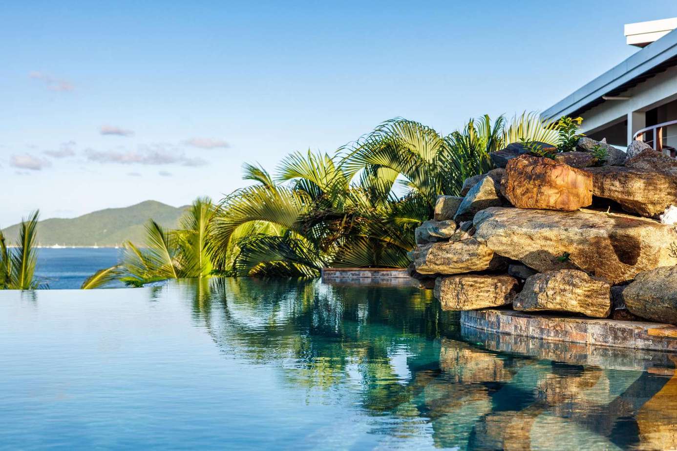 Infinity pool oasis with stunning mountain and ocean views