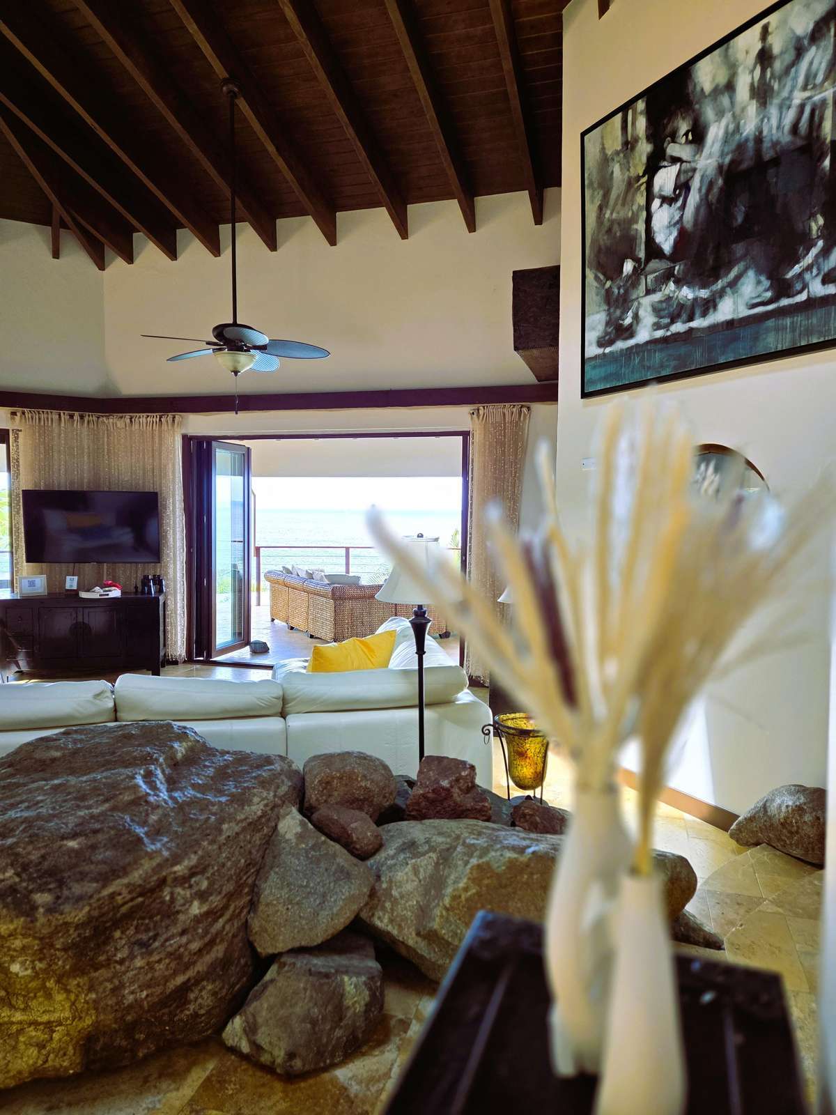 Cozy living room with vaulted ceilings and scenic views