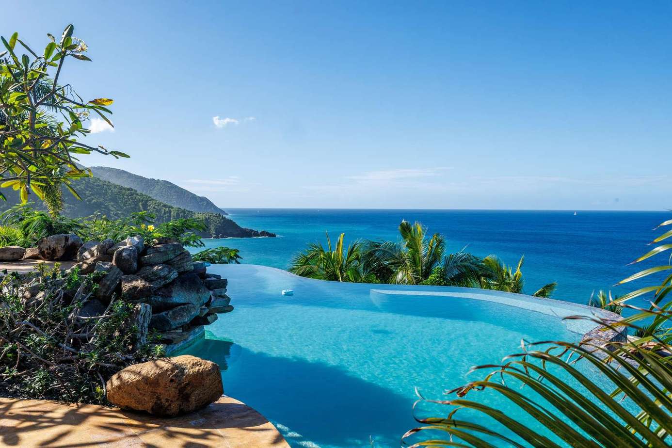 Infinity pool with stunning ocean and mountain views