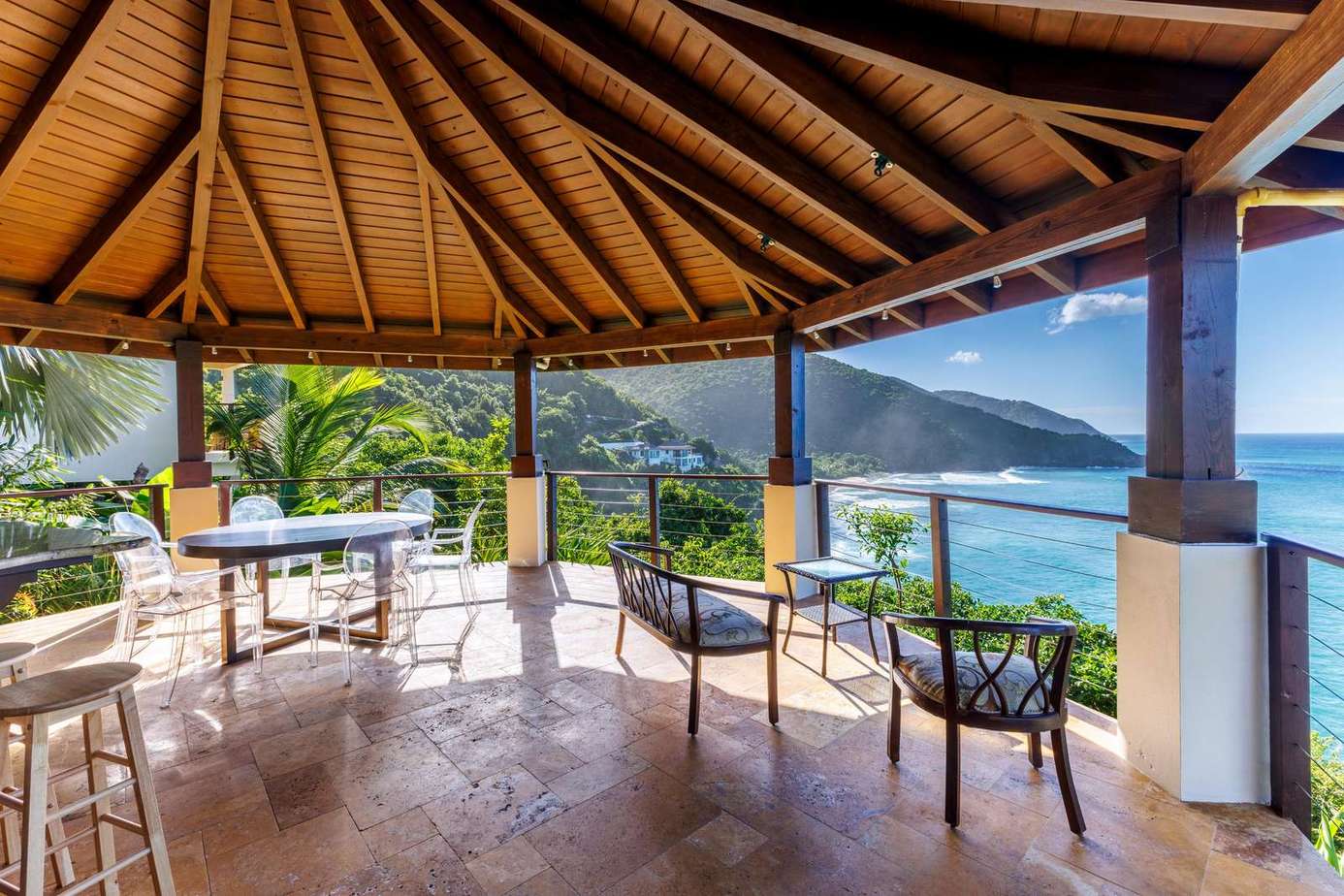Spacious covered patio with stunning ocean and mountain views