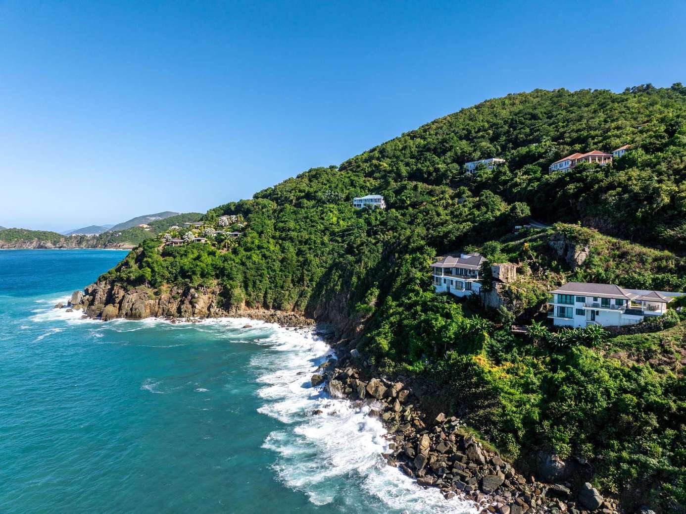 Secluded coastal retreat with stunning ocean views and lush hillsides