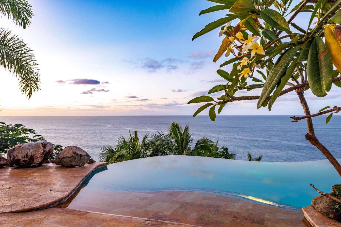 Infinity pool overlooking a stunning ocean sunset view