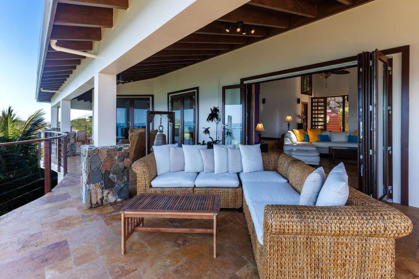 Spacious outdoor patio with cozy seating and scenic views
