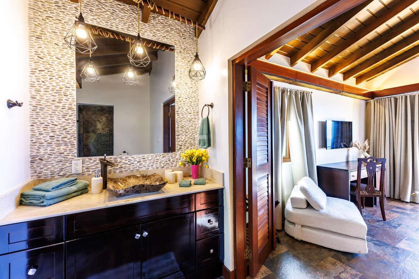 Chic bathroom retreat flowing into cozy living area