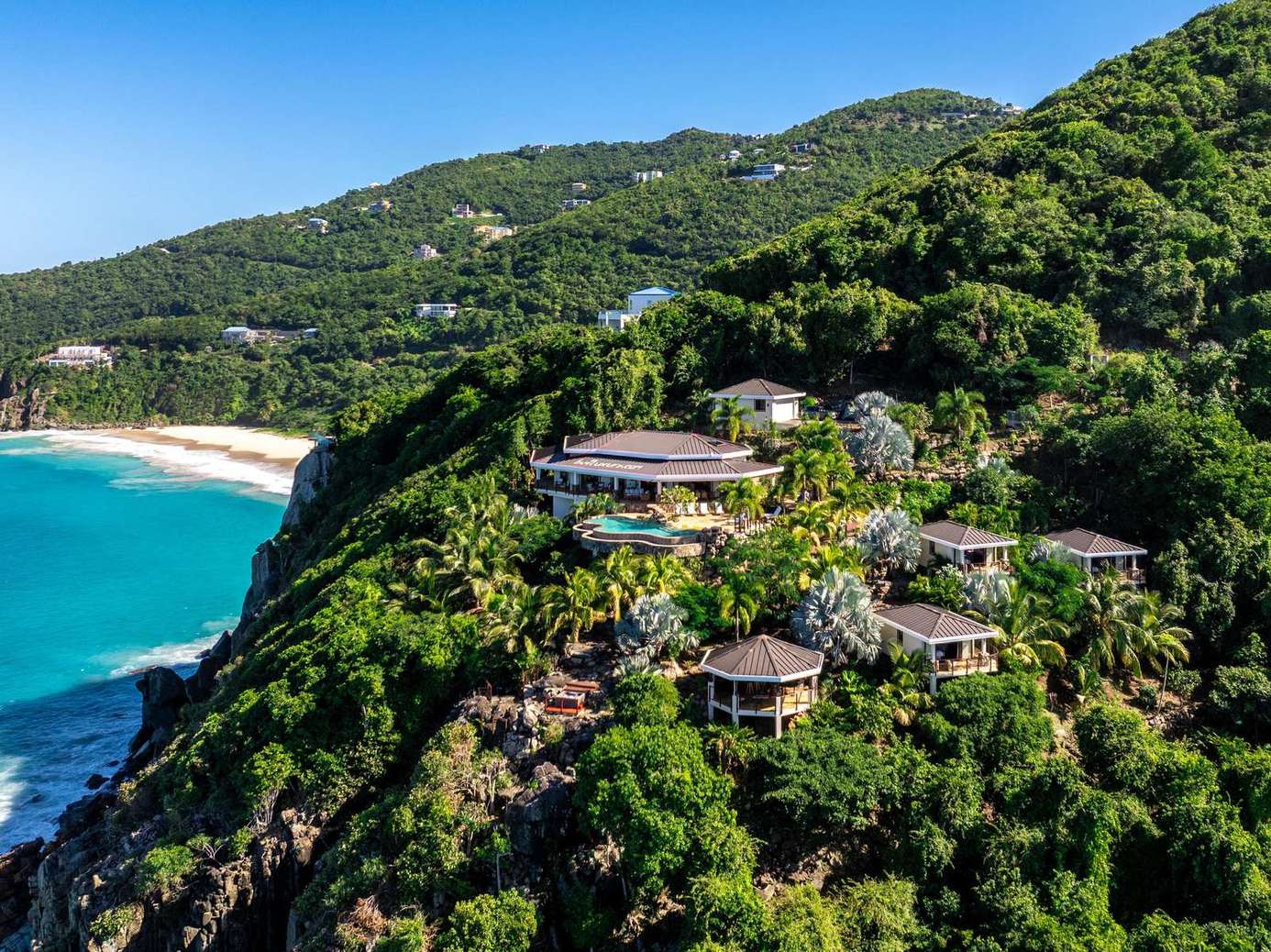Secluded hillside villas with stunning ocean views and beach access