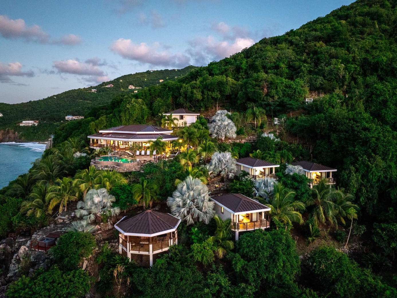 Secluded hillside villas with stunning ocean views and lush greenery
