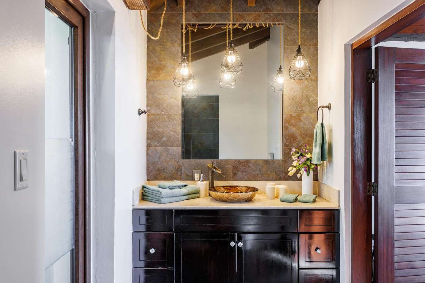 Chic bathroom retreat with modern fixtures and warm lighting