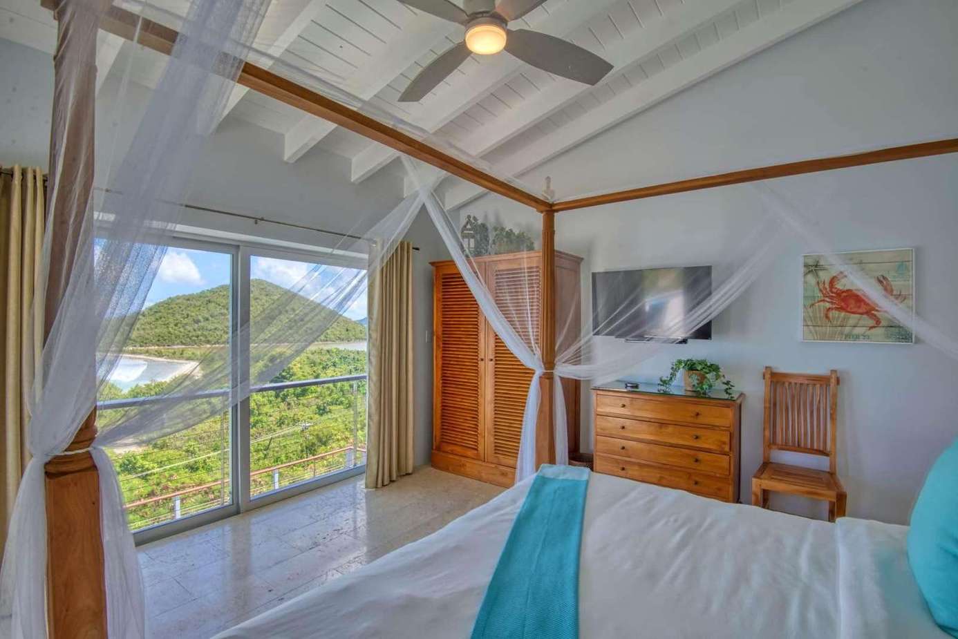 Bright bedroom with mountain views and airy canopy bed
