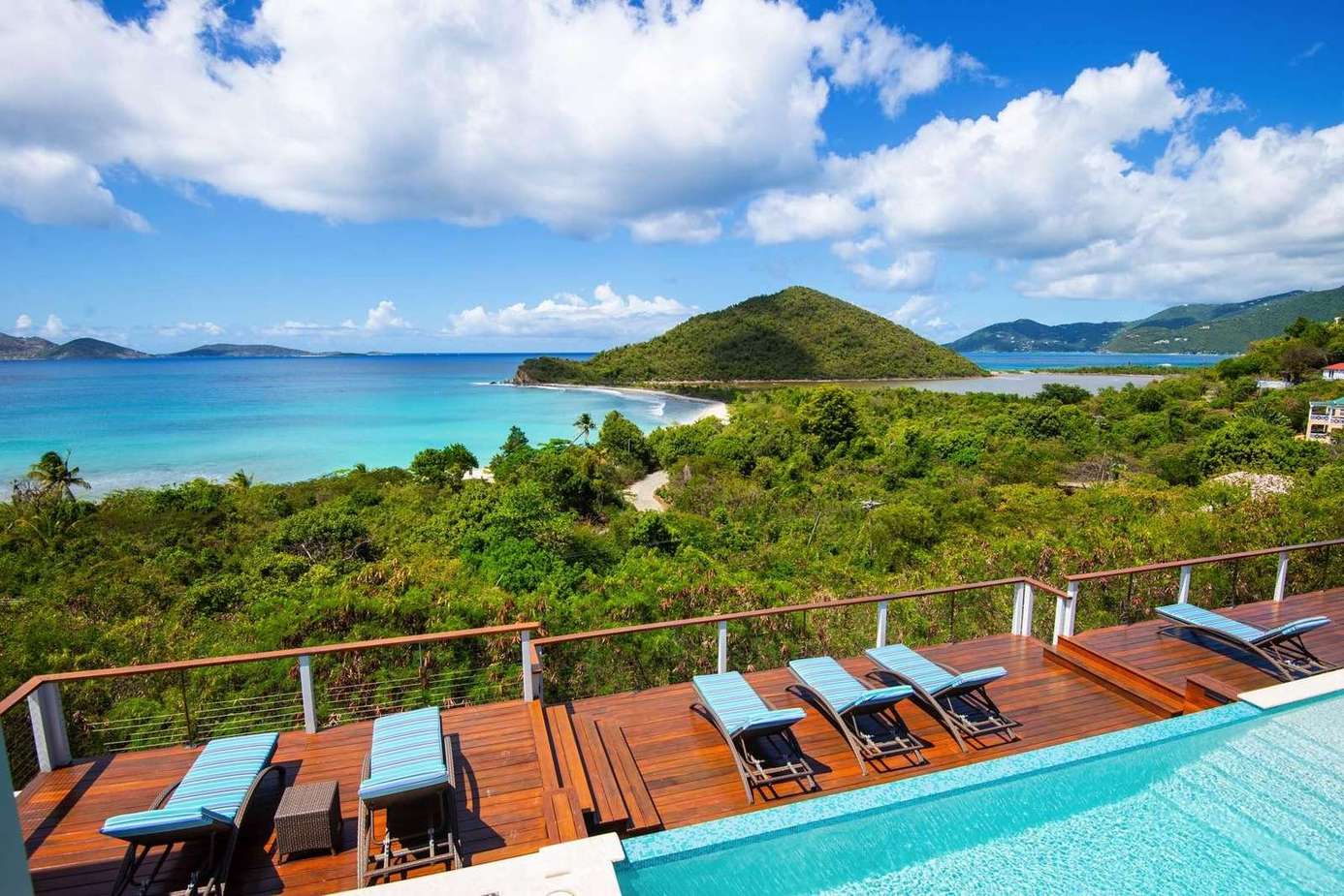 Sun-drenched pool deck with panoramic ocean views
