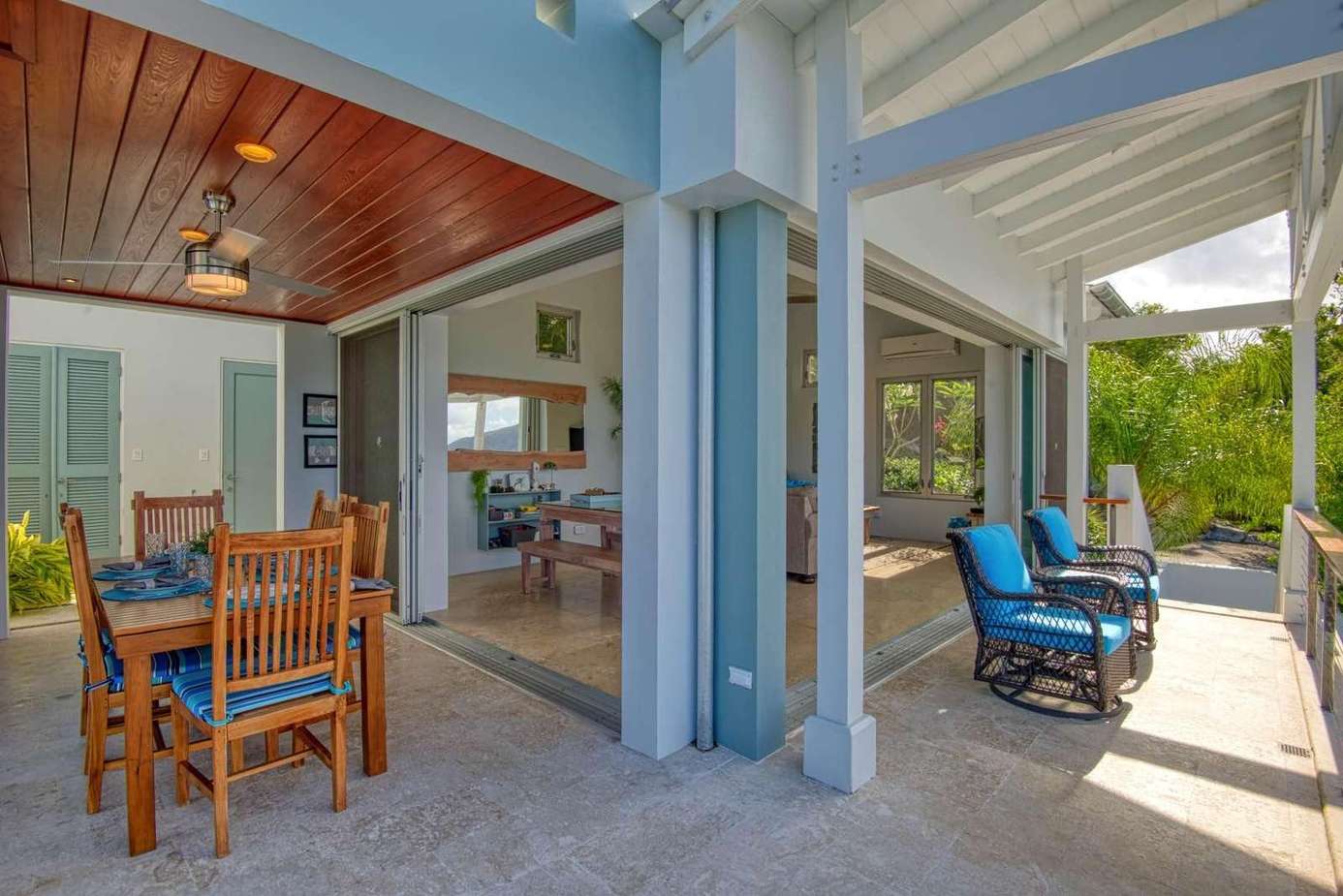 Spacious covered patio with cozy seating and dining area