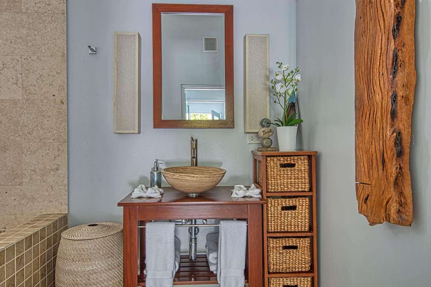 Serene bathroom retreat with elegant vessel sink and natural accents