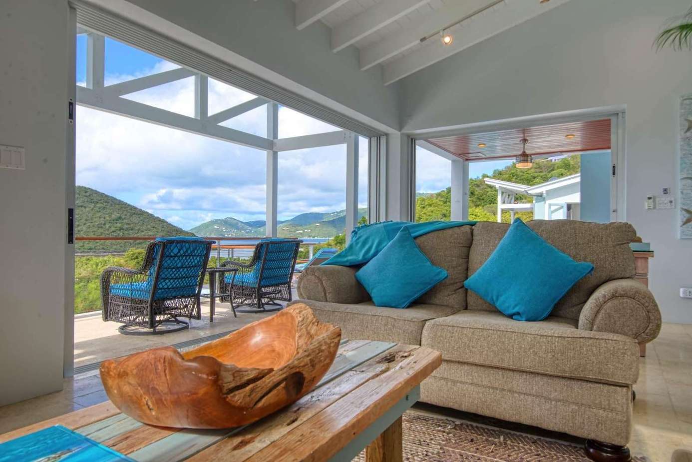 Sunlit living room with panoramic mountain views and cozy seating