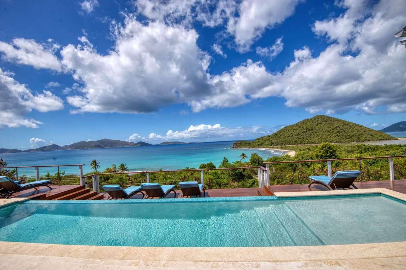 Infinity pool with panoramic ocean and mountain views