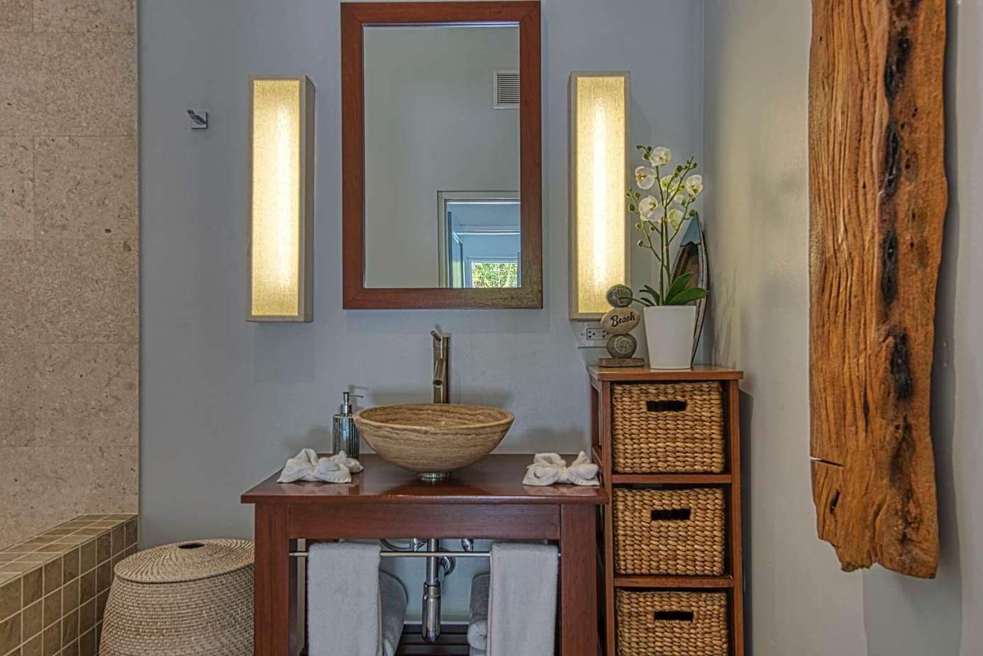 Serene bathroom retreat with warm lighting and natural accents