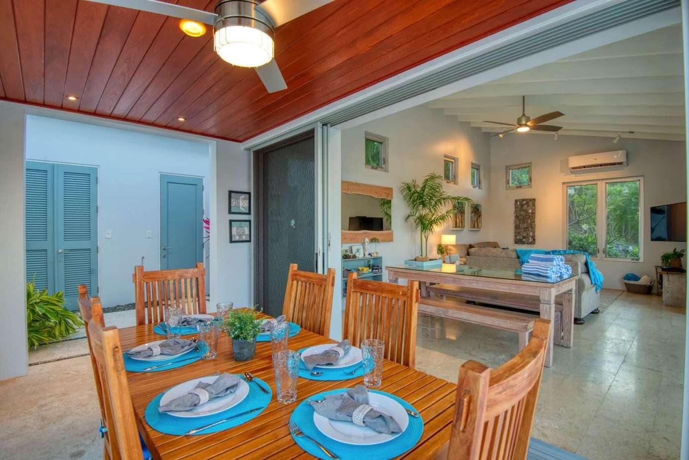 Bright open dining and living area with tropical charm