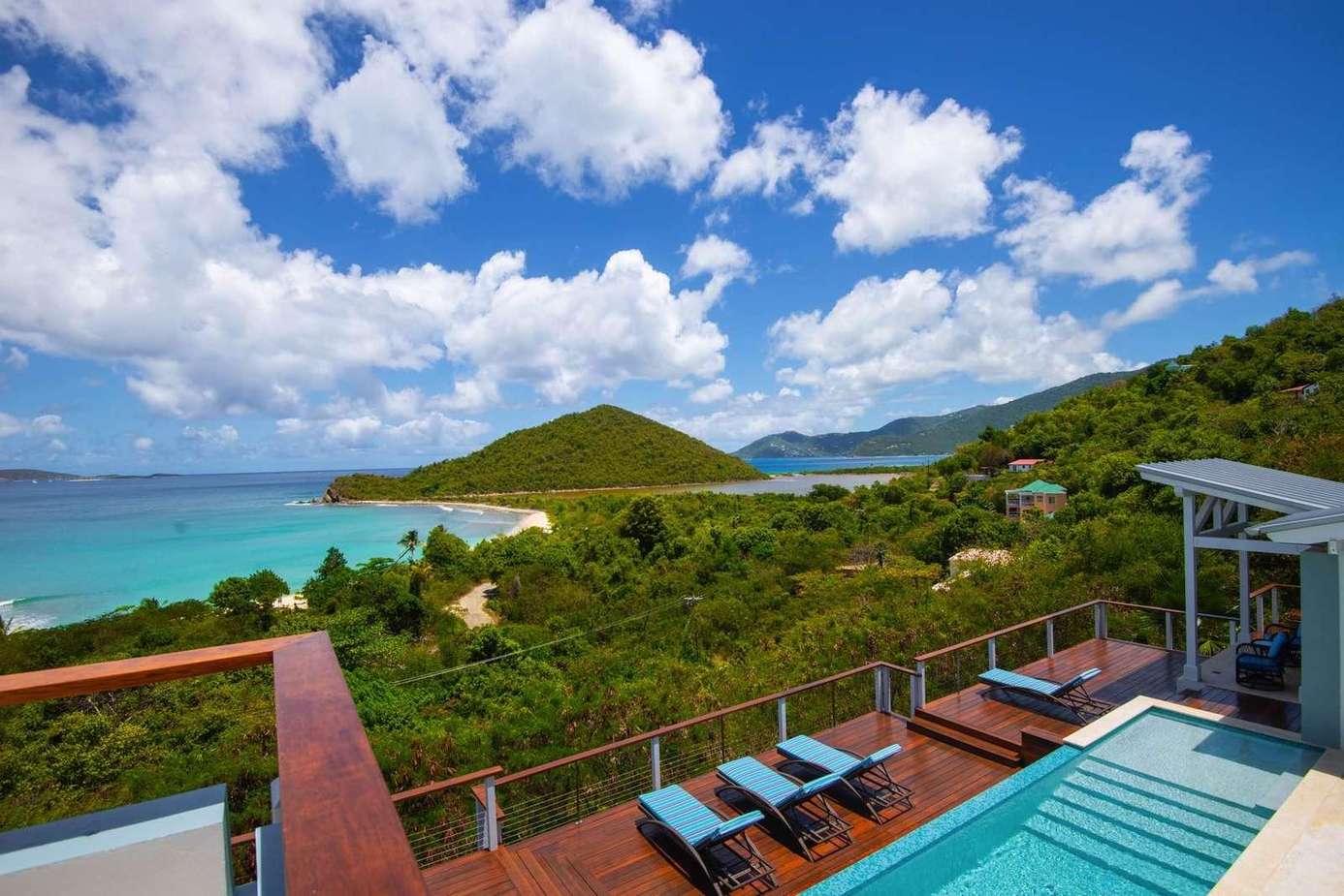 Ocean-view patio with pool and lounge seating for ultimate relaxation