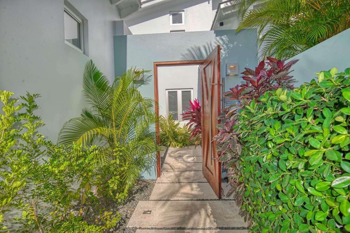 Lush garden pathway leading to your private retreat entrance