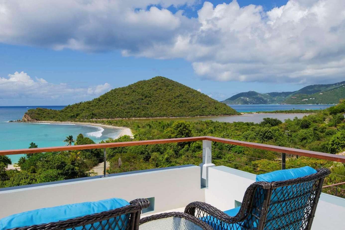 Oceanfront balcony with panoramic island and beach views