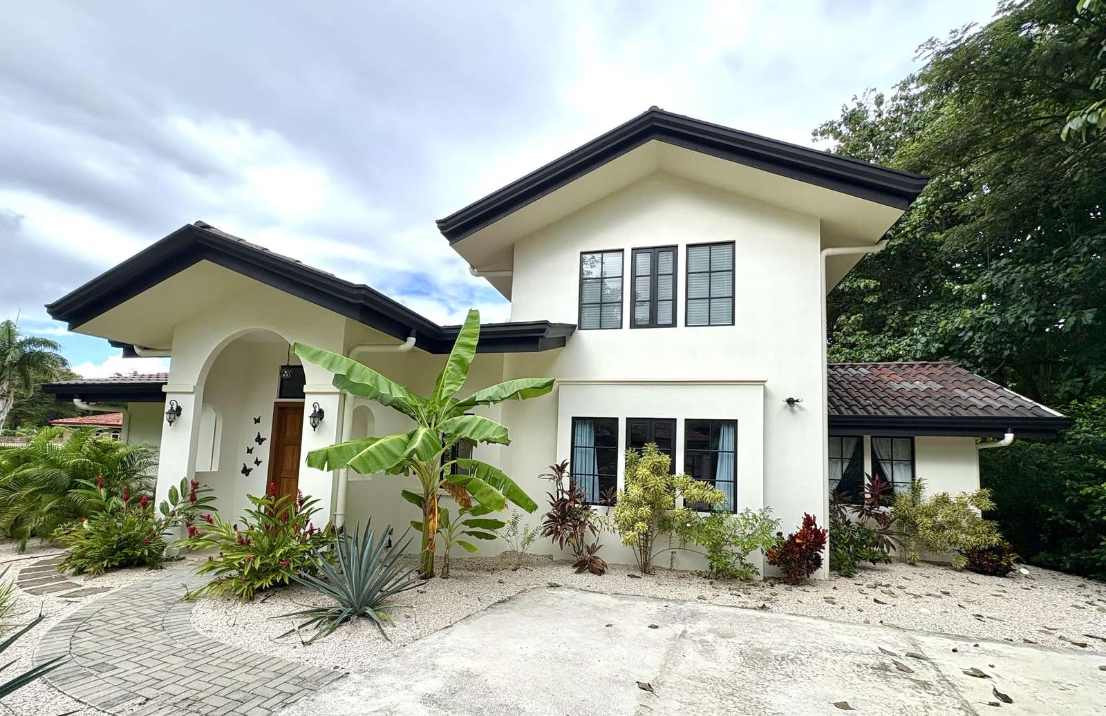 Spacious two-story home with lush garden views and ample parking