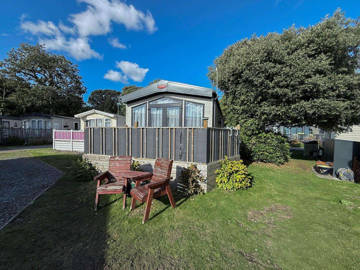This holiday home decking is the perfect spot to unwind after a day exploring the beach. - property