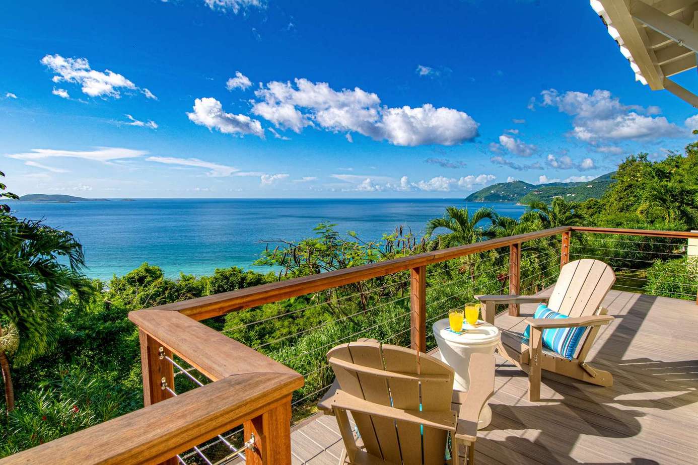 Oceanfront deck with panoramic views and cozy seating