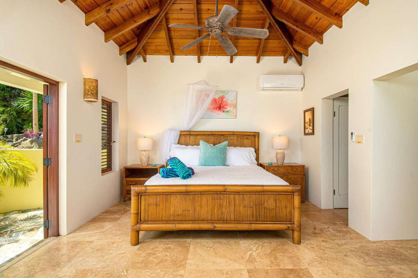 Airy bedroom with vaulted ceiling and garden views