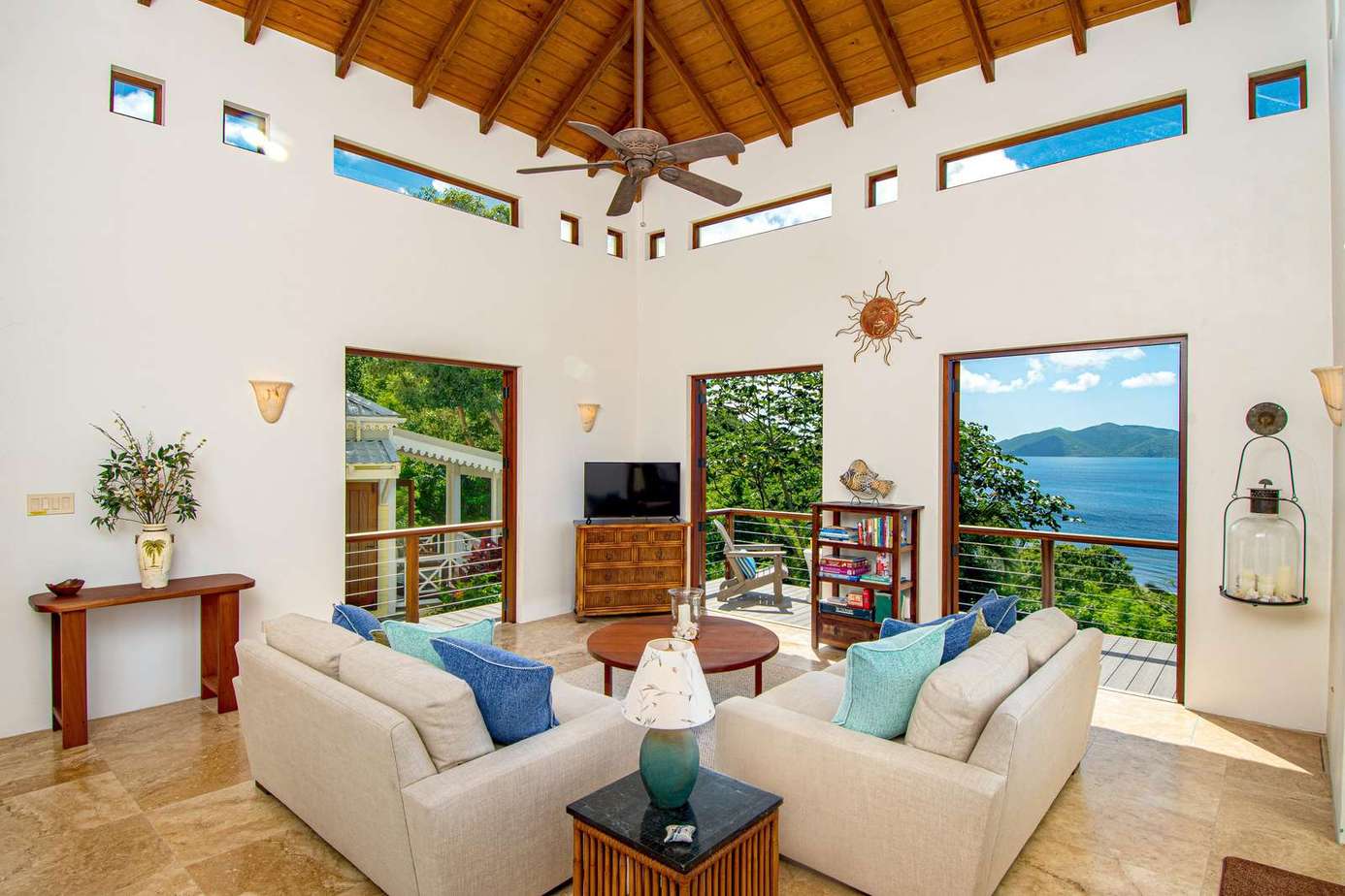 Spacious living room with vaulted ceilings and lake views