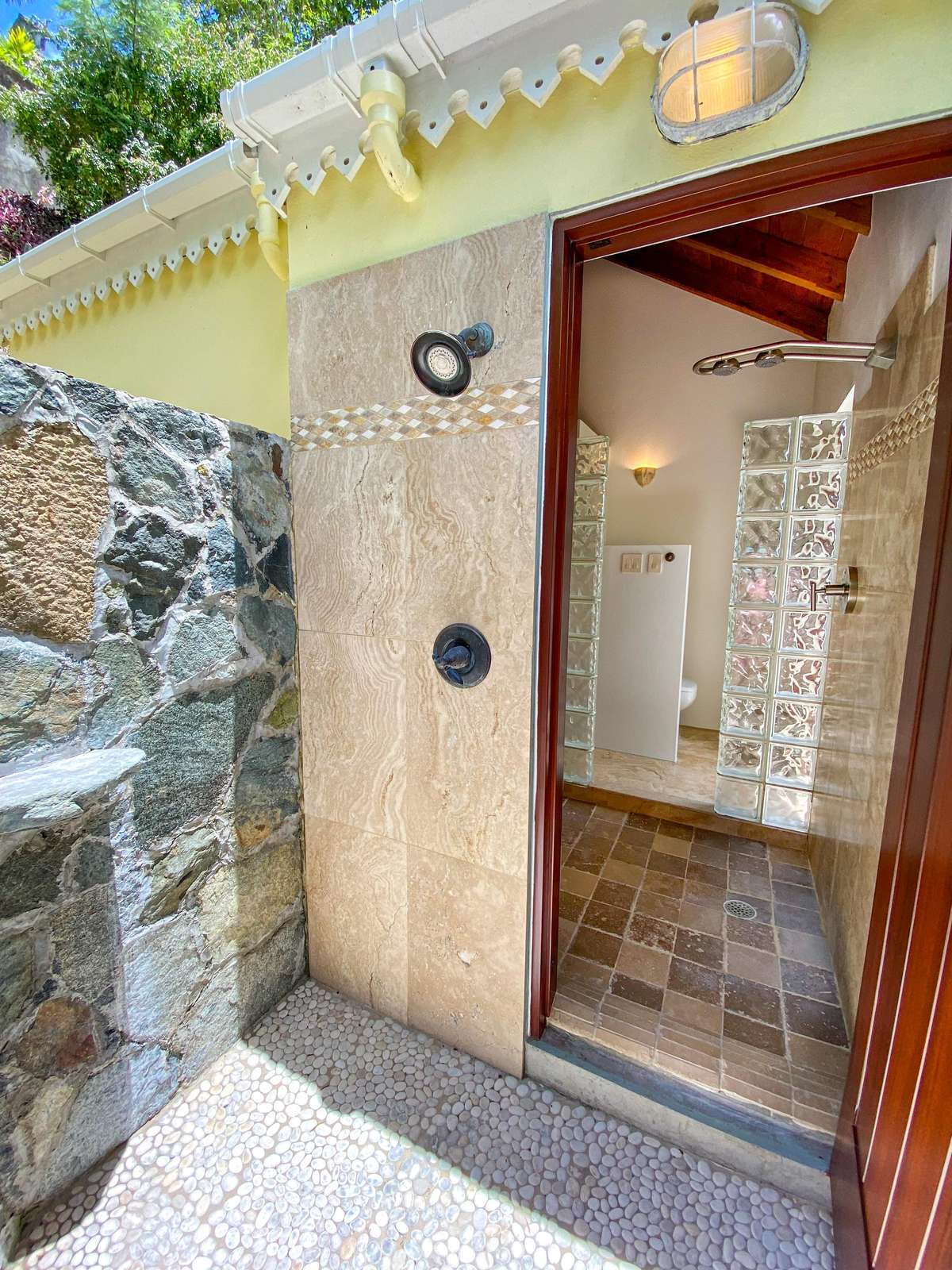 Charming entryway with rustic stone and warm wood door