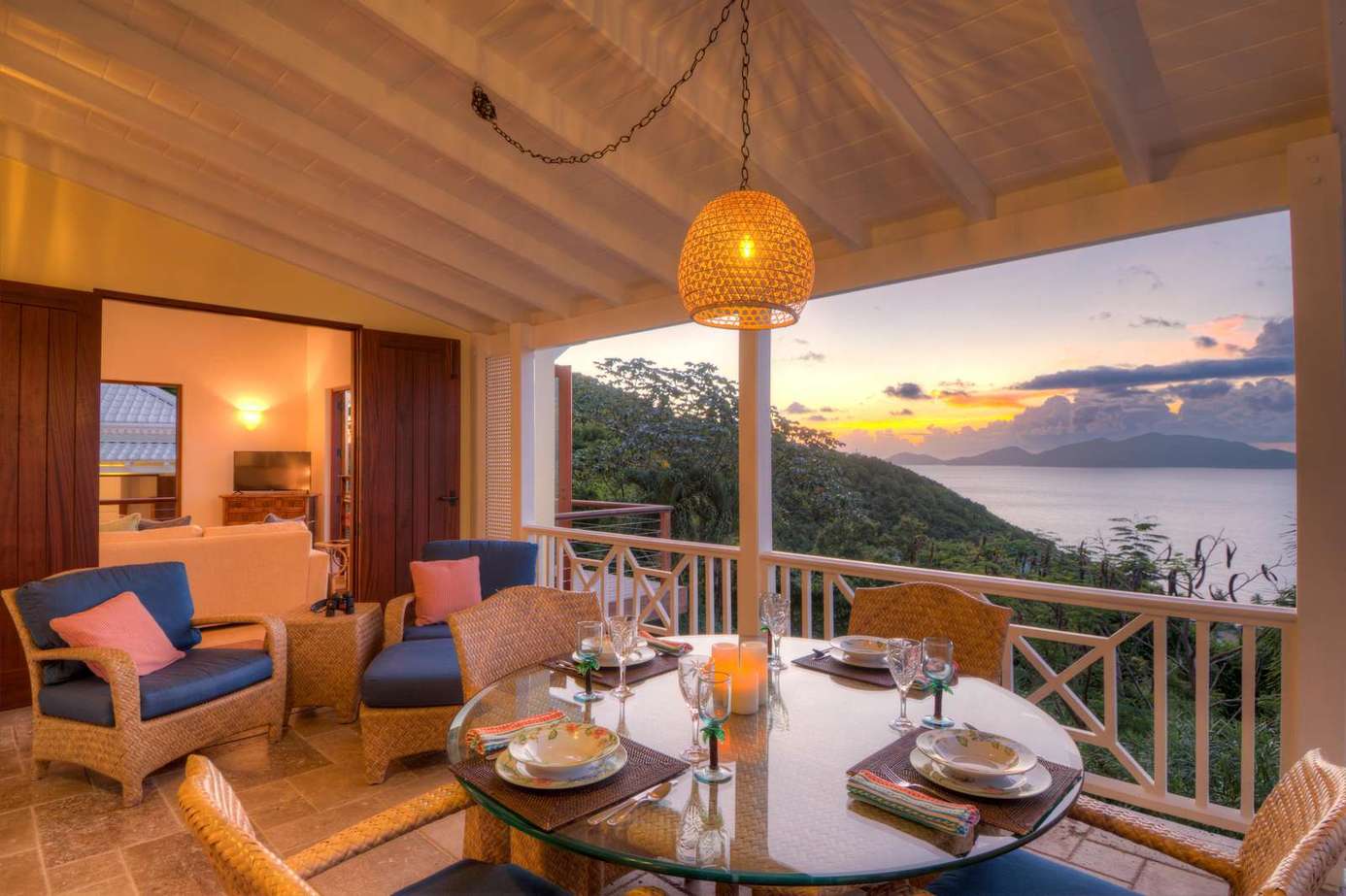 Sunset dining on the spacious balcony with cozy seating