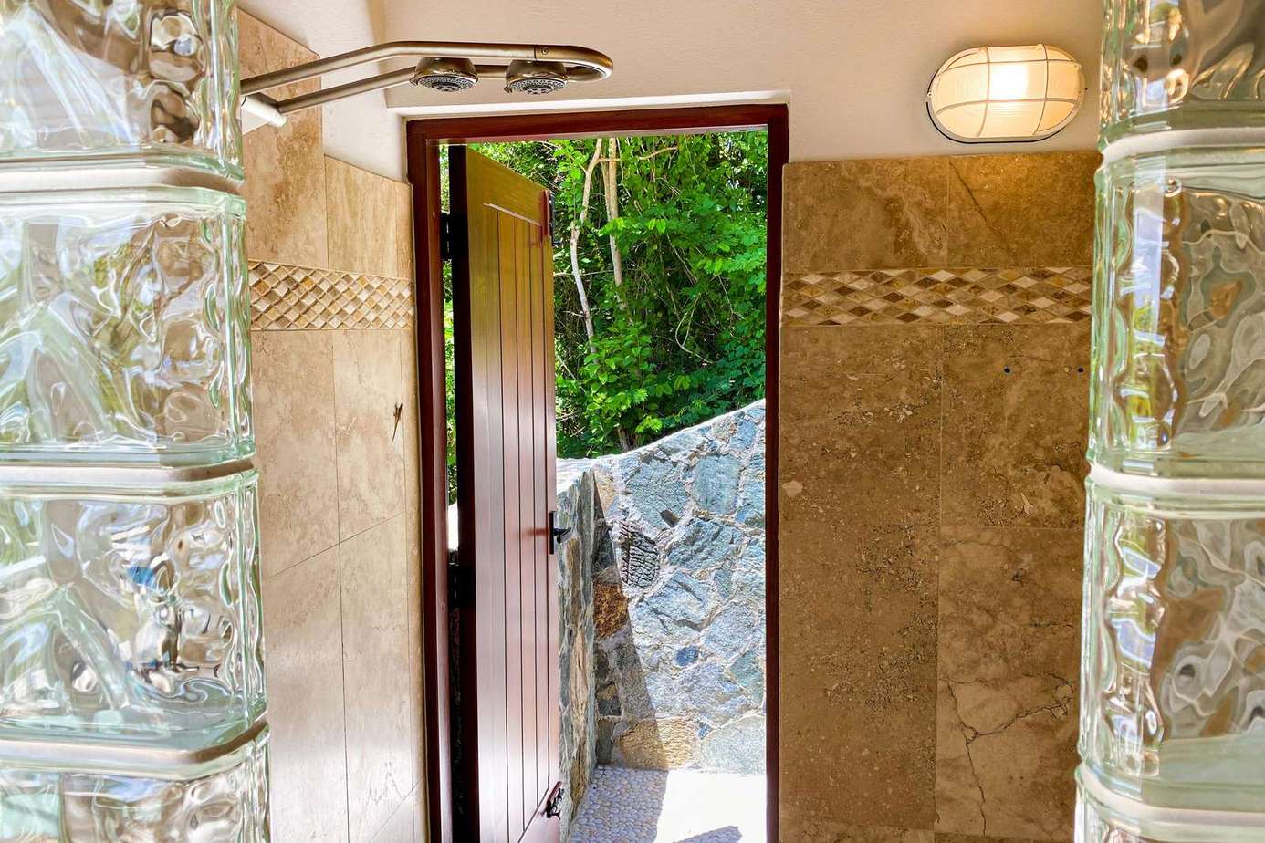 Charming entryway with natural stone and glass block accents