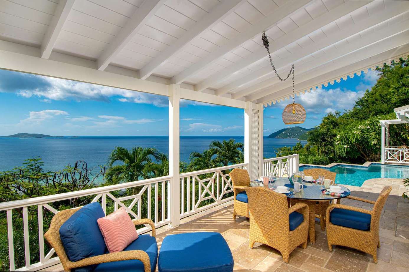 Spacious covered patio with panoramic ocean views and cozy seating