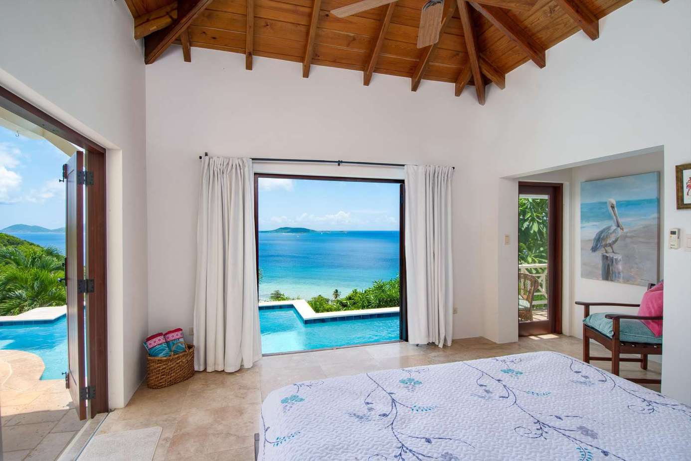 Serene bedroom with stunning ocean and pool views