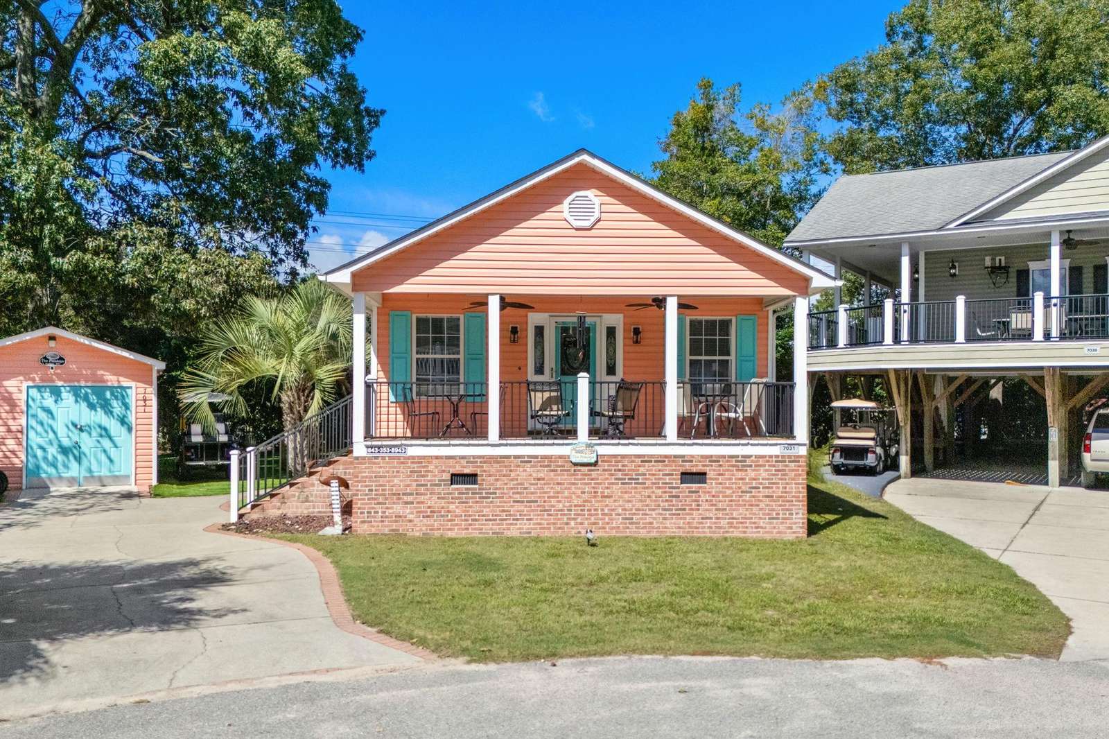 Charming lakeside cottage with cozy front porch seating - property