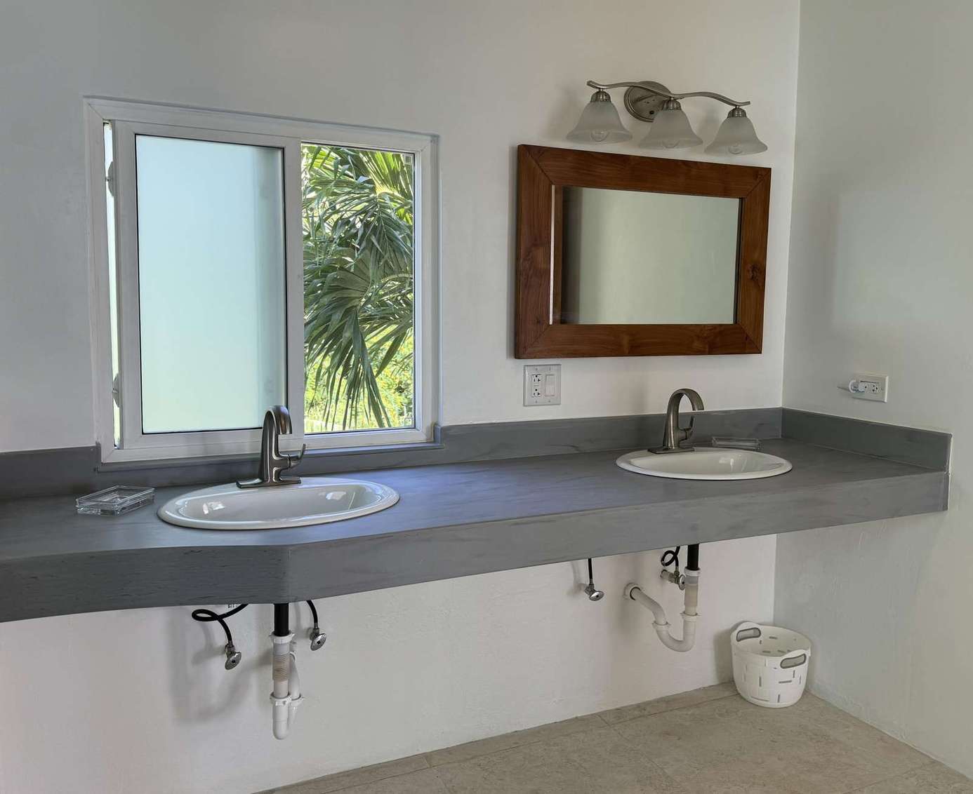 Bright and airy bathroom with dual sinks and natural light