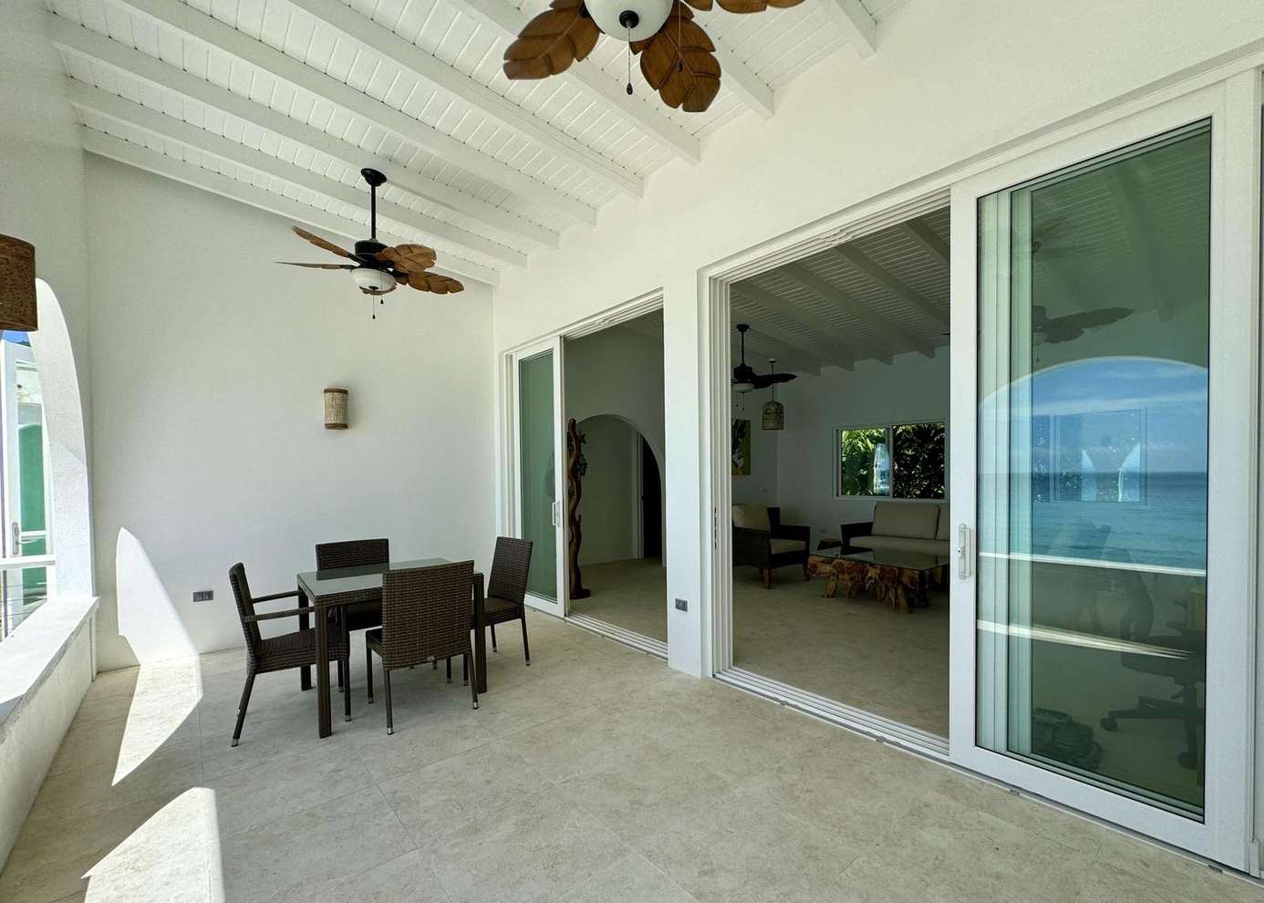 Spacious covered patio with ceiling fans for relaxing gatherings