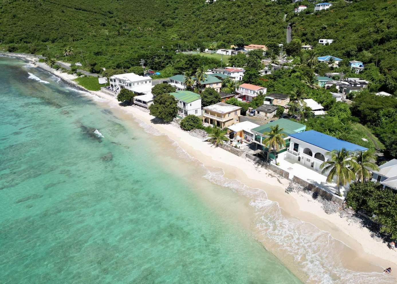 Secluded beachfront homes with crystal-clear turquoise waters