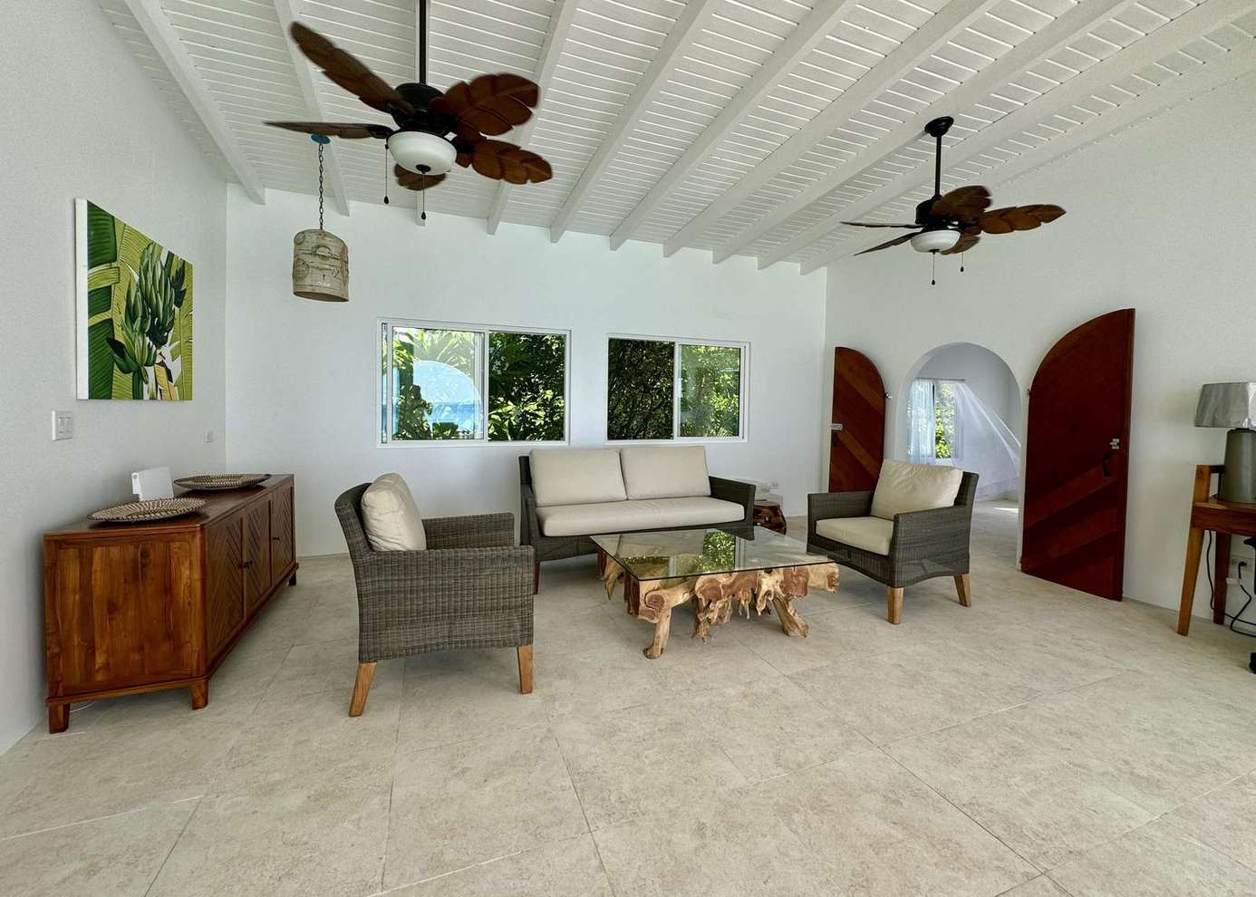 Airy screened porch with cozy seating and natural light
