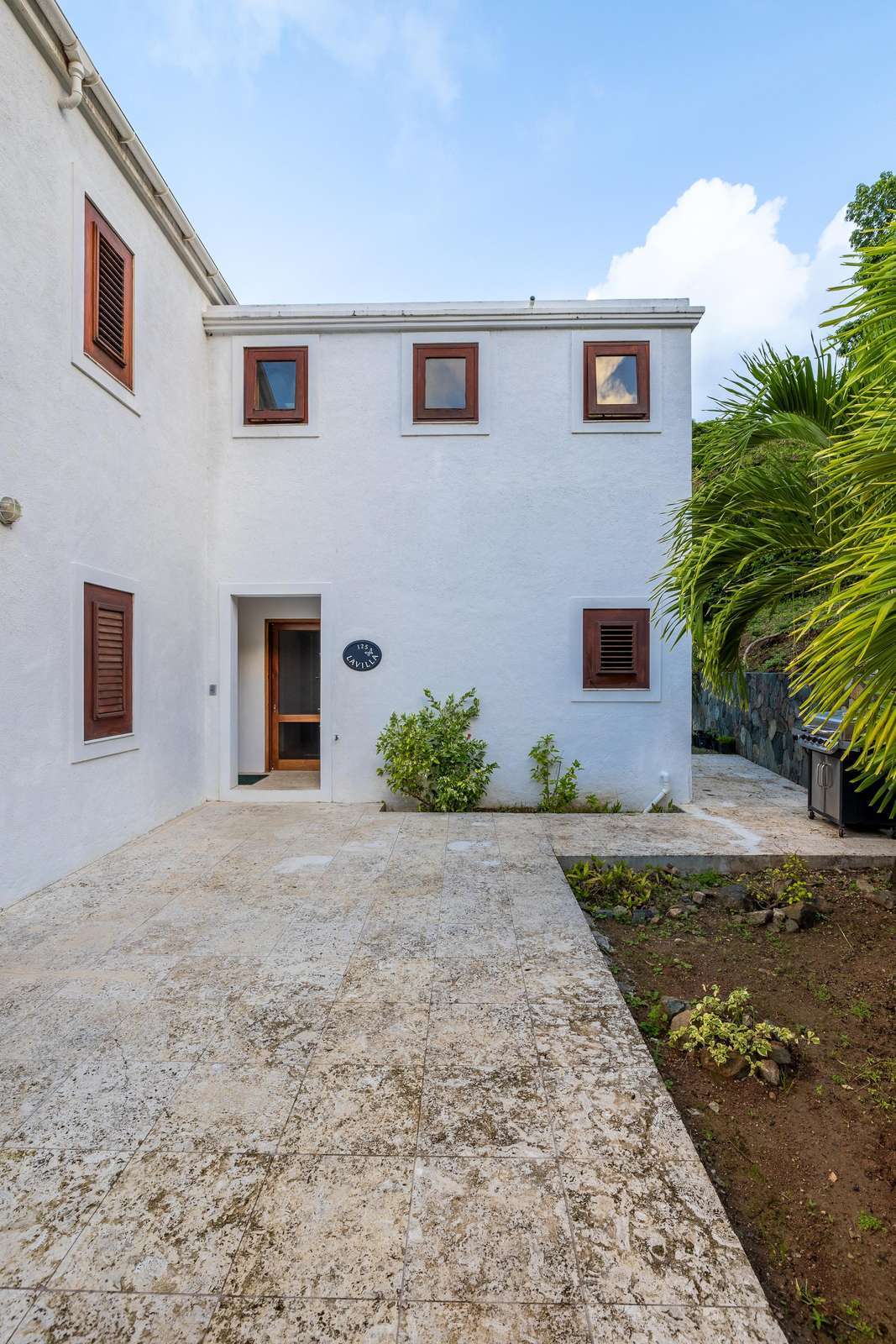 Charming courtyard with lush greenery and cozy seating