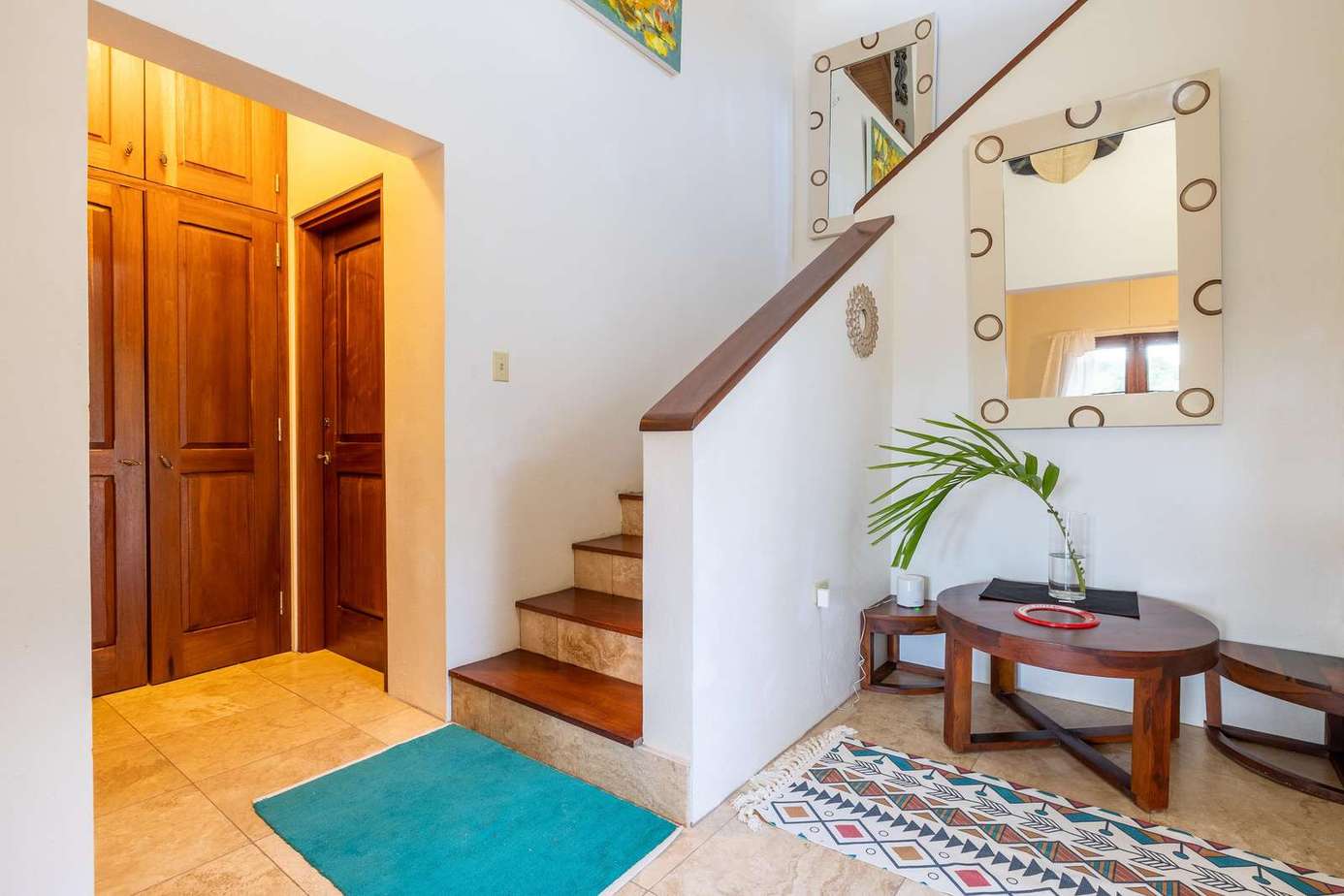 Bright and welcoming entryway with cozy seating nook