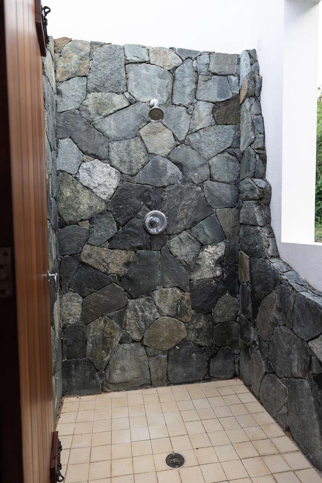 Rustic stone-tiled shower for a refreshing escape